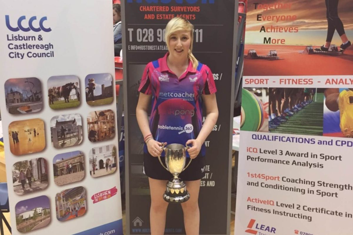 Charlotte Carey holding trophy