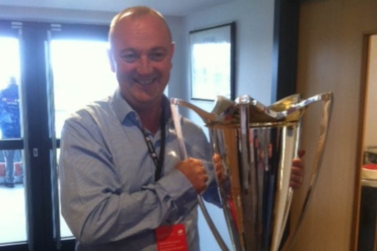 Andy holding the trophy of the rugby union championships